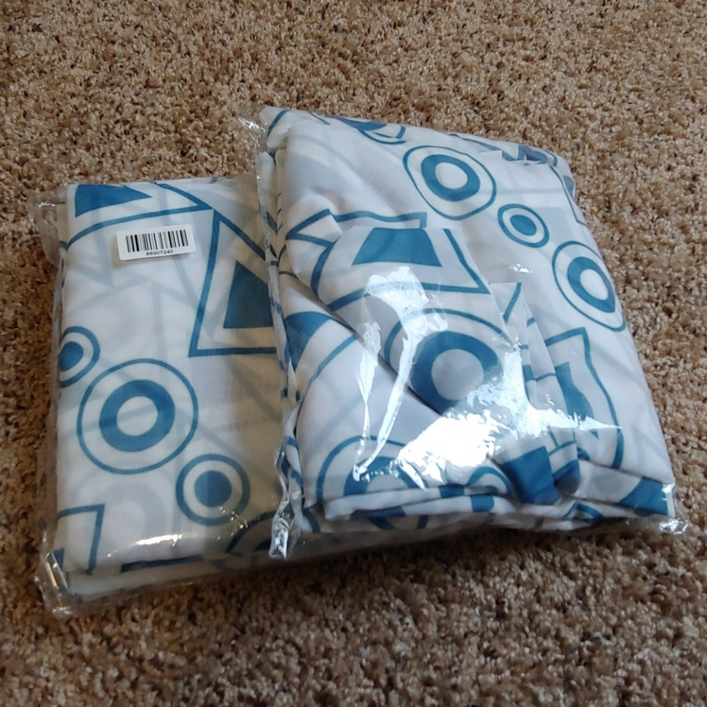 White curtains with teal accents